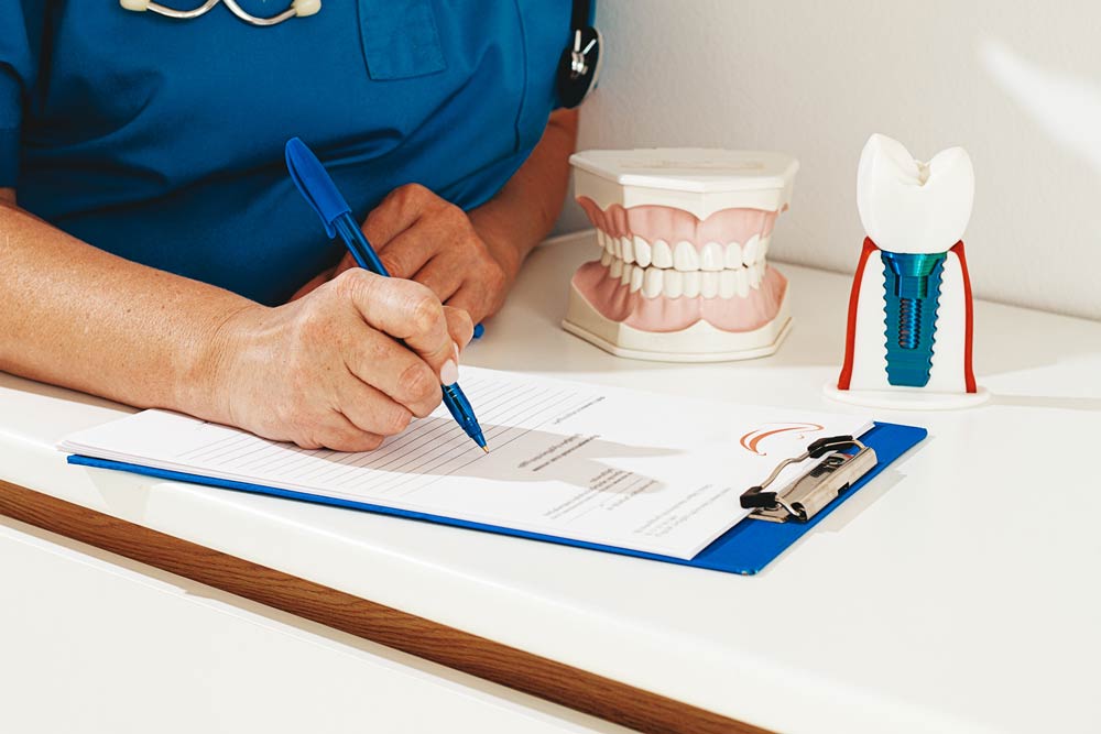 a-dentist-in-a-blue-uniform-studies-patient-inform-2025-11-20-19-46-58-utc