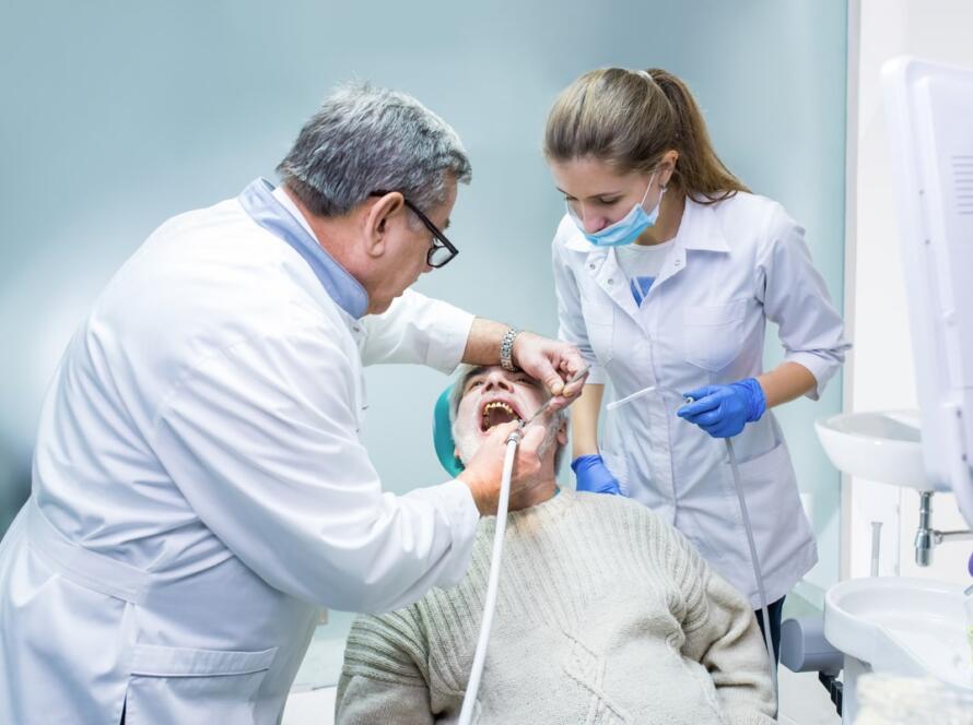 dentist-and-assistant-working-2024-09-14-05-04-20-utc (1)-min